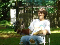 Volunteer Jeanne working with Athena the peregrine falcon.